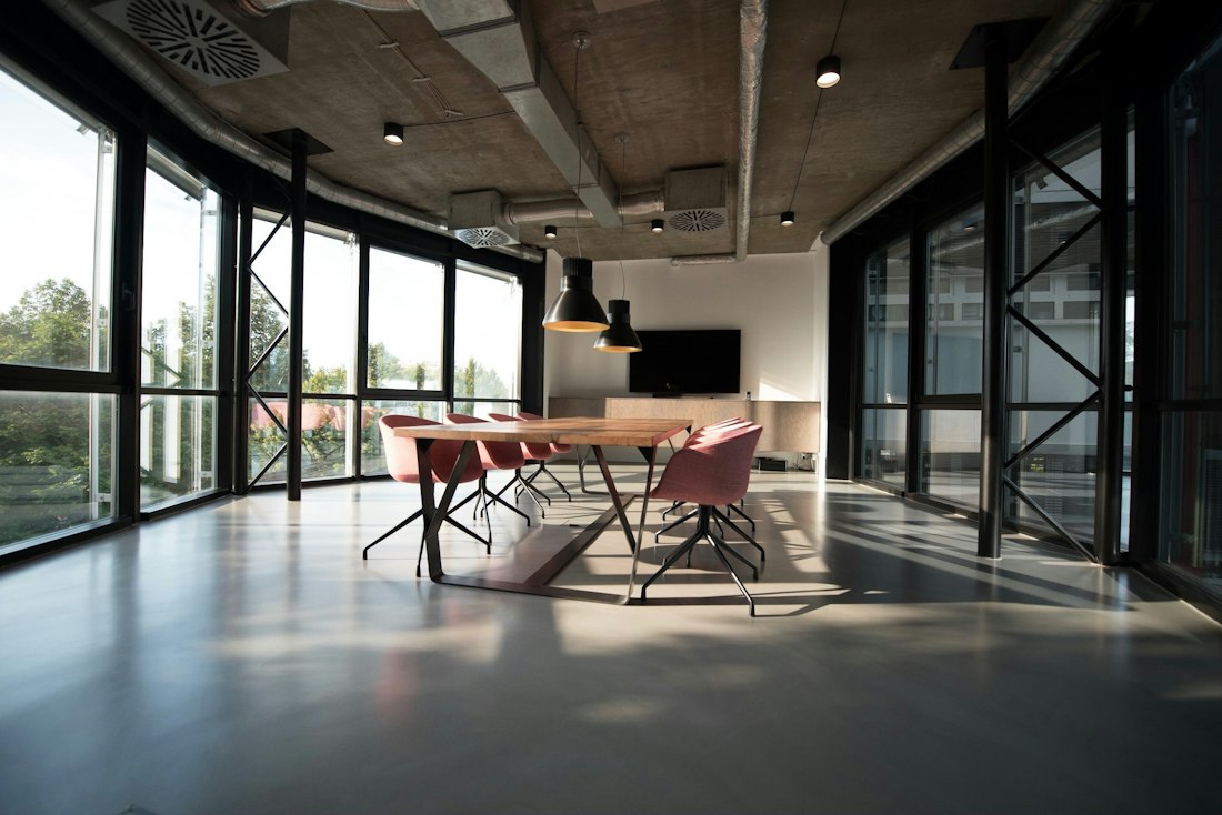 A bright workspace with desks and plants